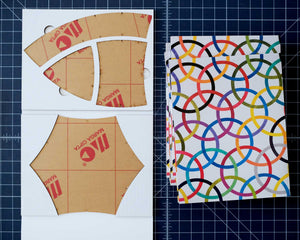 Set of four templates displayed in cardboard packaging, unfloded.